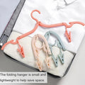 FOLDING CLOTHES HANGERS INCORPORATING CLOTHES PEGS